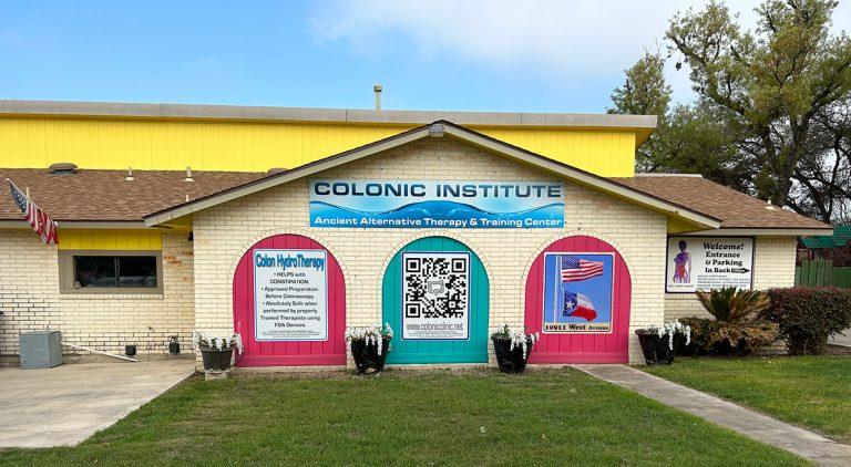 store front of colonic institute with yellow paint and red and teal accents